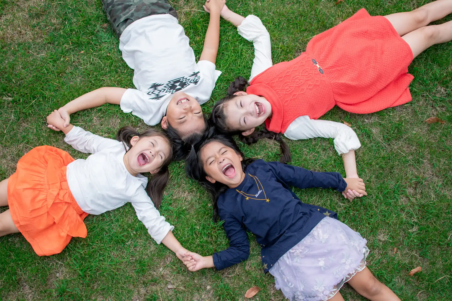 Children holding hands — Our Mission image